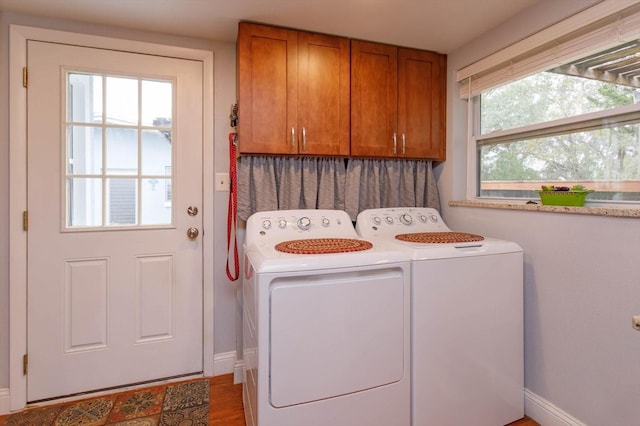 laundry area with cabinets and washer and dryer