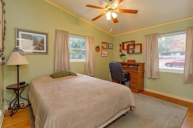 bedroom featuring ceiling fan, light hardwood / wood-style flooring, crown molding, and lofted ceiling