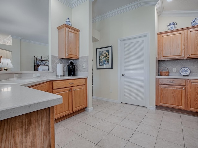 kitchen featuring tasteful backsplash, lofted ceiling, ornamental molding, and light tile patterned flooring