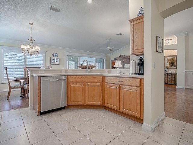 kitchen featuring light tile patterned flooring, sink, ornamental molding, dishwasher, and ceiling fan with notable chandelier