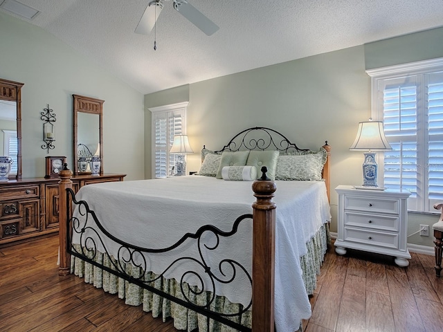 bedroom featuring dark wood-type flooring, ceiling fan, and lofted ceiling