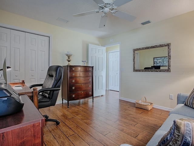 home office featuring ceiling fan and light wood-type flooring