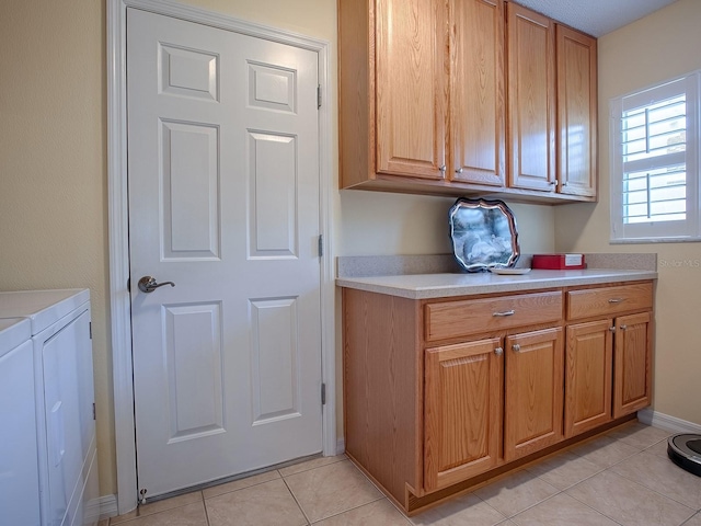 kitchen with independent washer and dryer and light tile patterned flooring