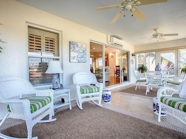 sunroom with ceiling fan and a wall unit AC