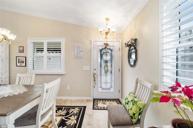 foyer with crown molding, baseboards, and a notable chandelier