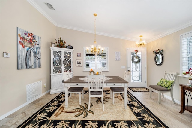 dining space featuring a chandelier, visible vents, crown molding, and baseboards