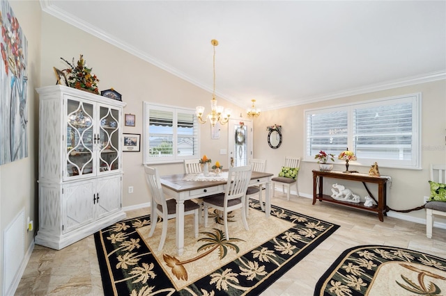 dining space featuring ornamental molding, lofted ceiling, a chandelier, and baseboards