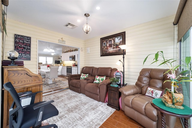 living room featuring a chandelier