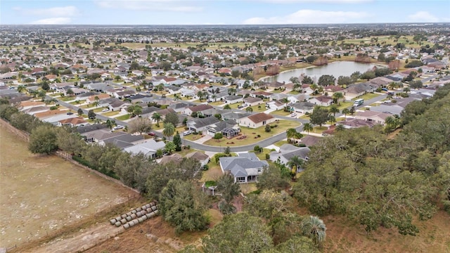 birds eye view of property featuring a water view and a residential view