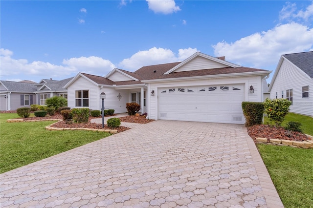 ranch-style house featuring a garage and a front yard