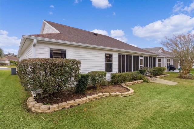 rear view of property with a lawn