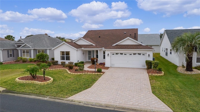 view of front of house with a garage and a front yard