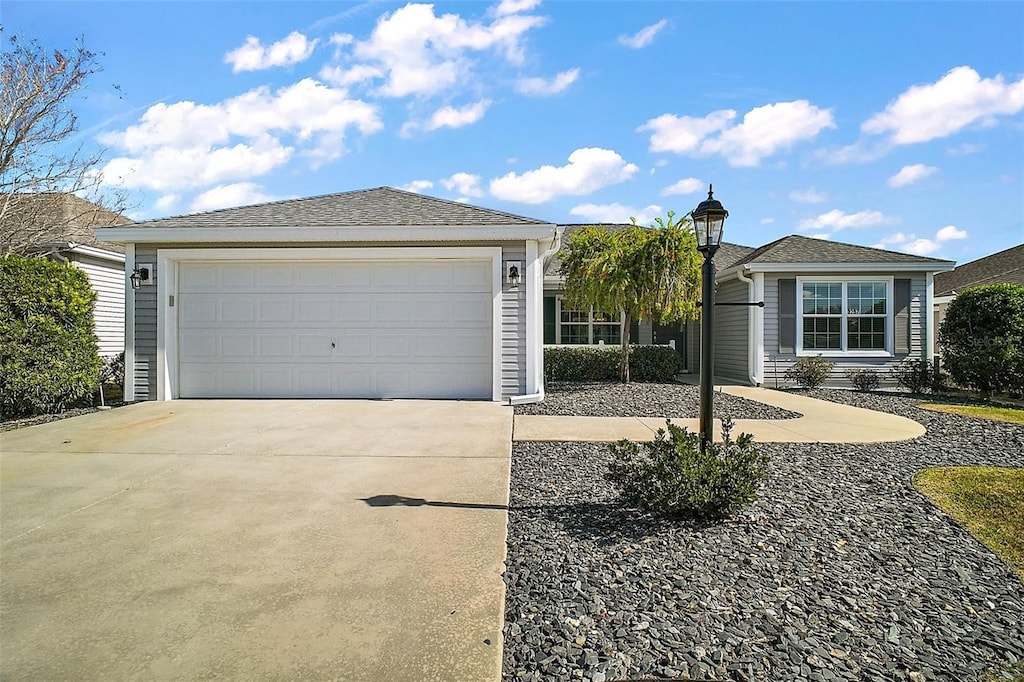 ranch-style home featuring a garage