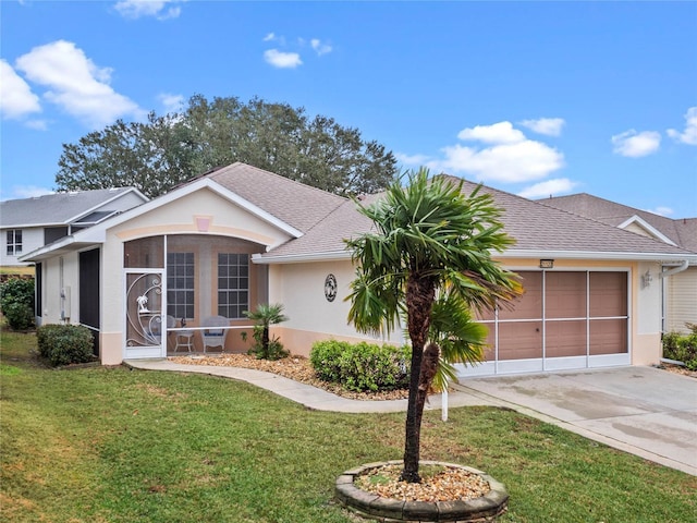 ranch-style house with a garage and a front yard