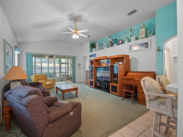 living room with lofted ceiling, tile patterned floors, and ceiling fan