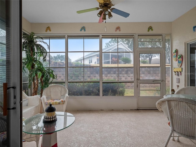 sunroom featuring ceiling fan and a wealth of natural light