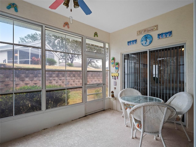 sunroom with ceiling fan and a healthy amount of sunlight