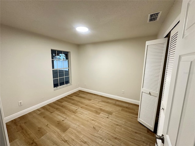 unfurnished bedroom with light hardwood / wood-style floors