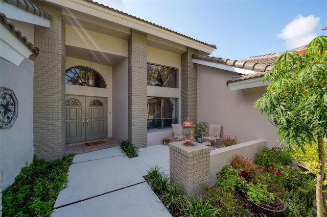 doorway to property featuring a patio area