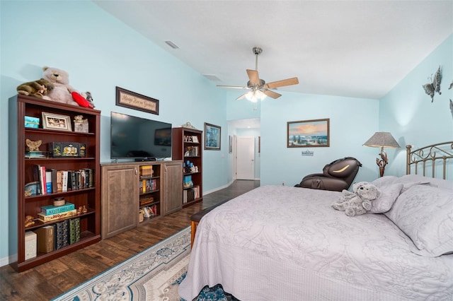 bedroom featuring lofted ceiling, dark wood-type flooring, and ceiling fan