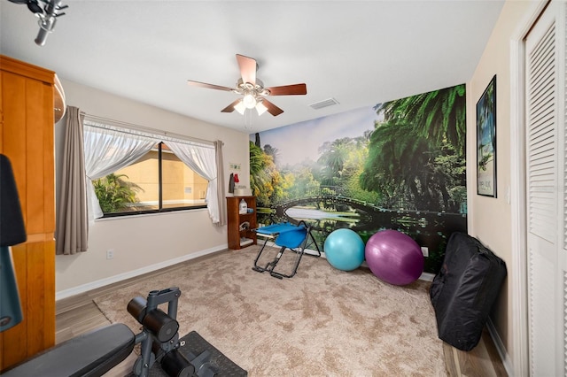 workout area with ceiling fan