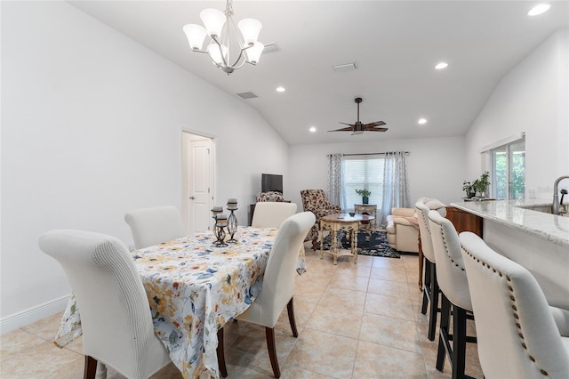 dining room featuring plenty of natural light, sink, and lofted ceiling