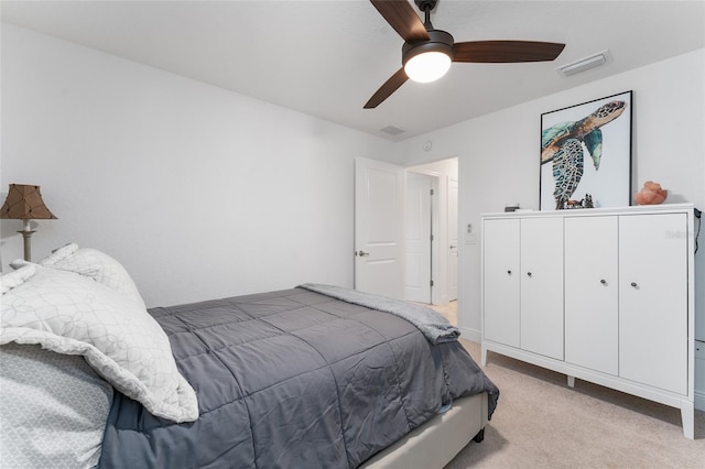 bedroom featuring light colored carpet and ceiling fan