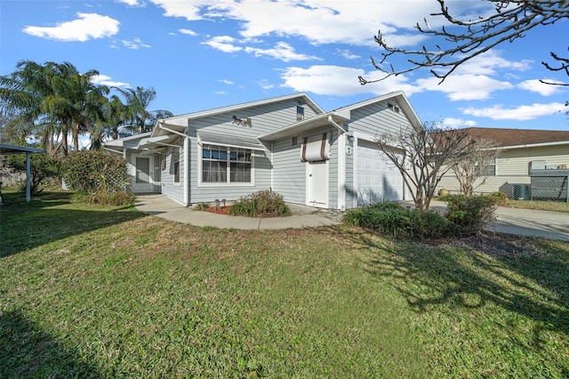 view of front of house with a garage and a front yard