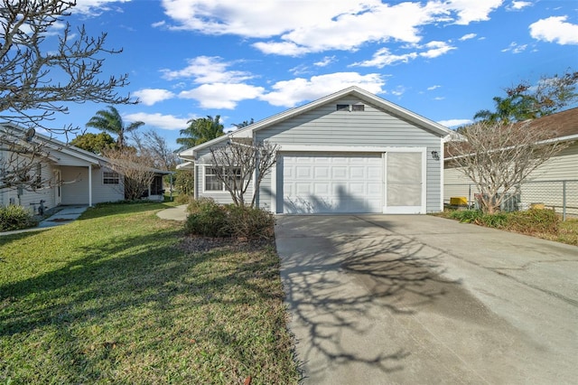 view of front of house featuring a garage and a front lawn