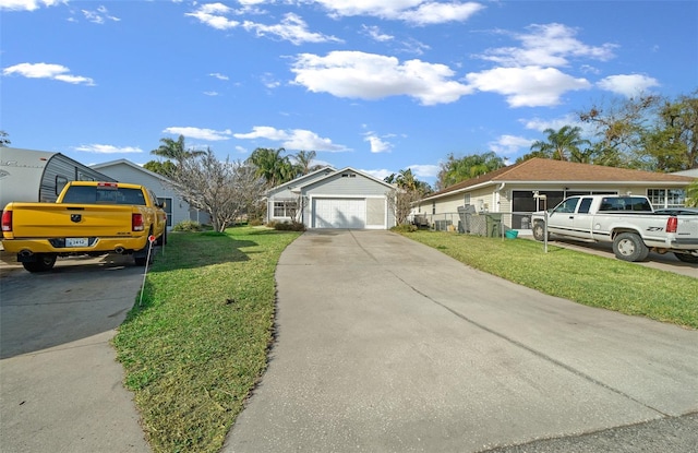 view of front of house with a front lawn and a garage