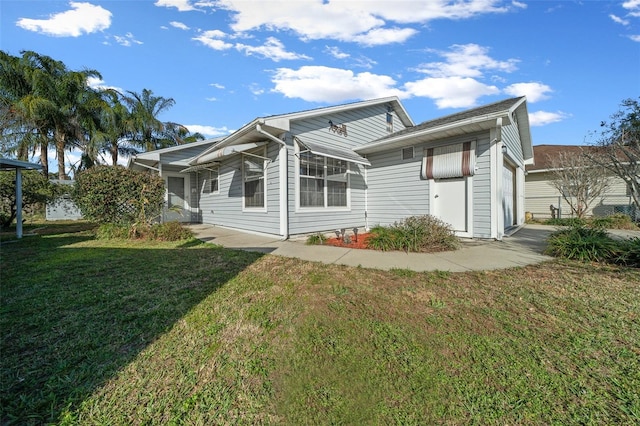 rear view of property featuring a yard