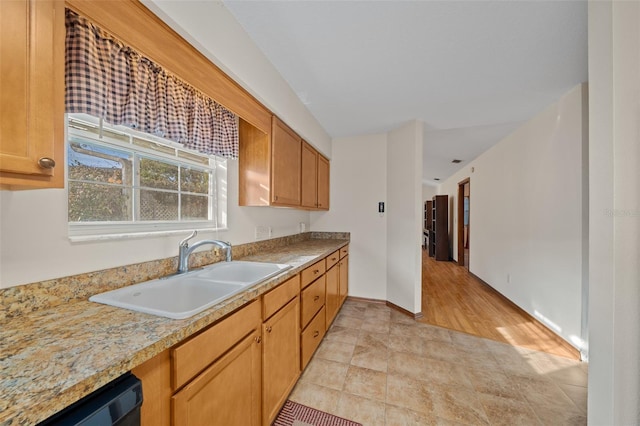 kitchen with sink and black dishwasher