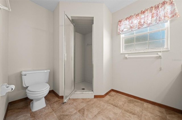 bathroom with toilet and walk in shower