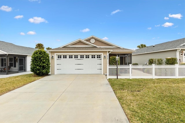 single story home featuring a garage and a front yard