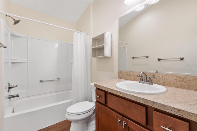 full bathroom with vanity, shower / bath combination with curtain, and toilet