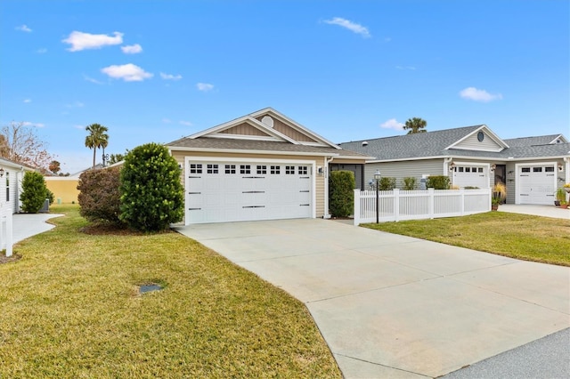 view of front of home featuring a garage and a front yard