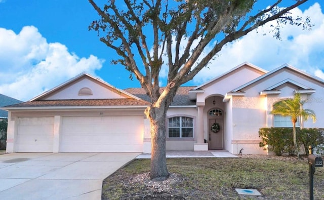 single story home featuring a garage