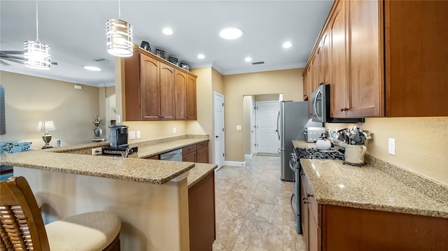 kitchen with a kitchen bar, crown molding, decorative light fixtures, kitchen peninsula, and stainless steel appliances