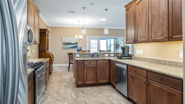 kitchen featuring crown molding, sink, kitchen peninsula, pendant lighting, and stainless steel appliances