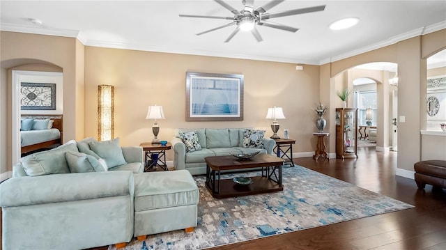 living room featuring crown molding, dark wood-type flooring, and ceiling fan