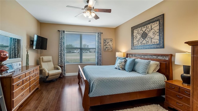 bedroom with ceiling fan and dark wood-type flooring