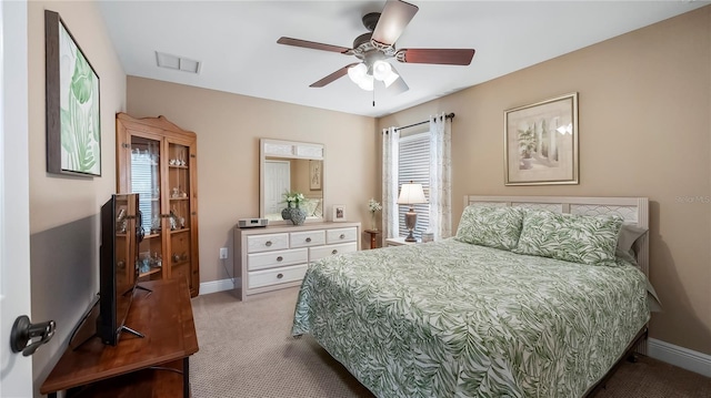 carpeted bedroom with ceiling fan