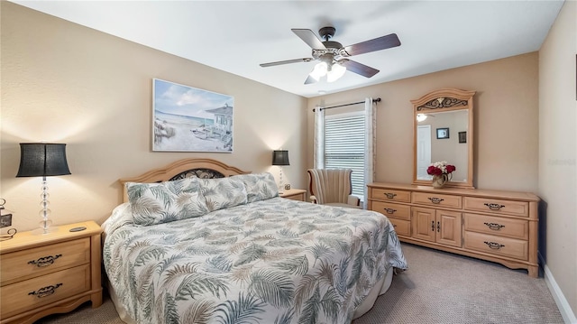 bedroom with light carpet and ceiling fan