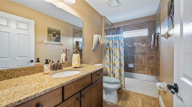 full bathroom featuring vanity, toilet, tile patterned floors, and shower / tub combo with curtain