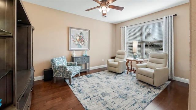 living area featuring hardwood / wood-style flooring and ceiling fan