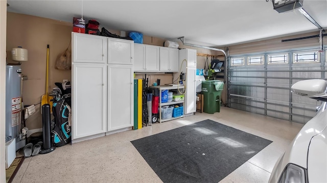 garage with water heater and a garage door opener