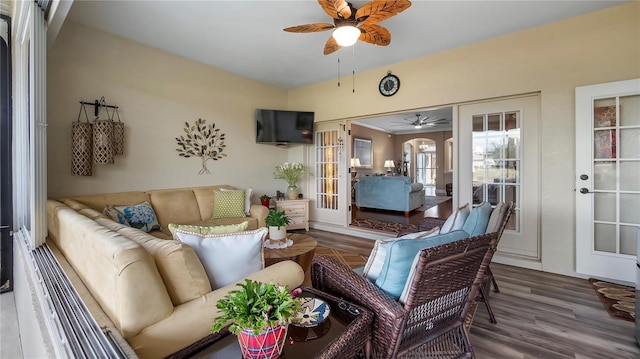 interior space with ceiling fan, french doors, and wood-type flooring