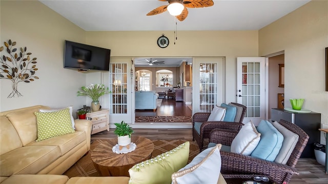 living room with ceiling fan, dark hardwood / wood-style floors, and french doors