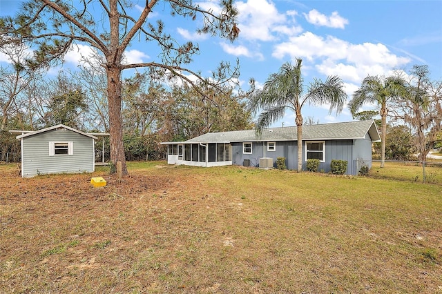 view of yard featuring central AC and a sunroom