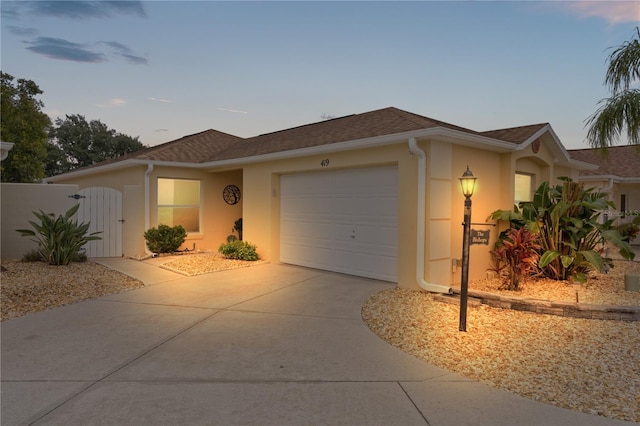 single story home featuring a garage